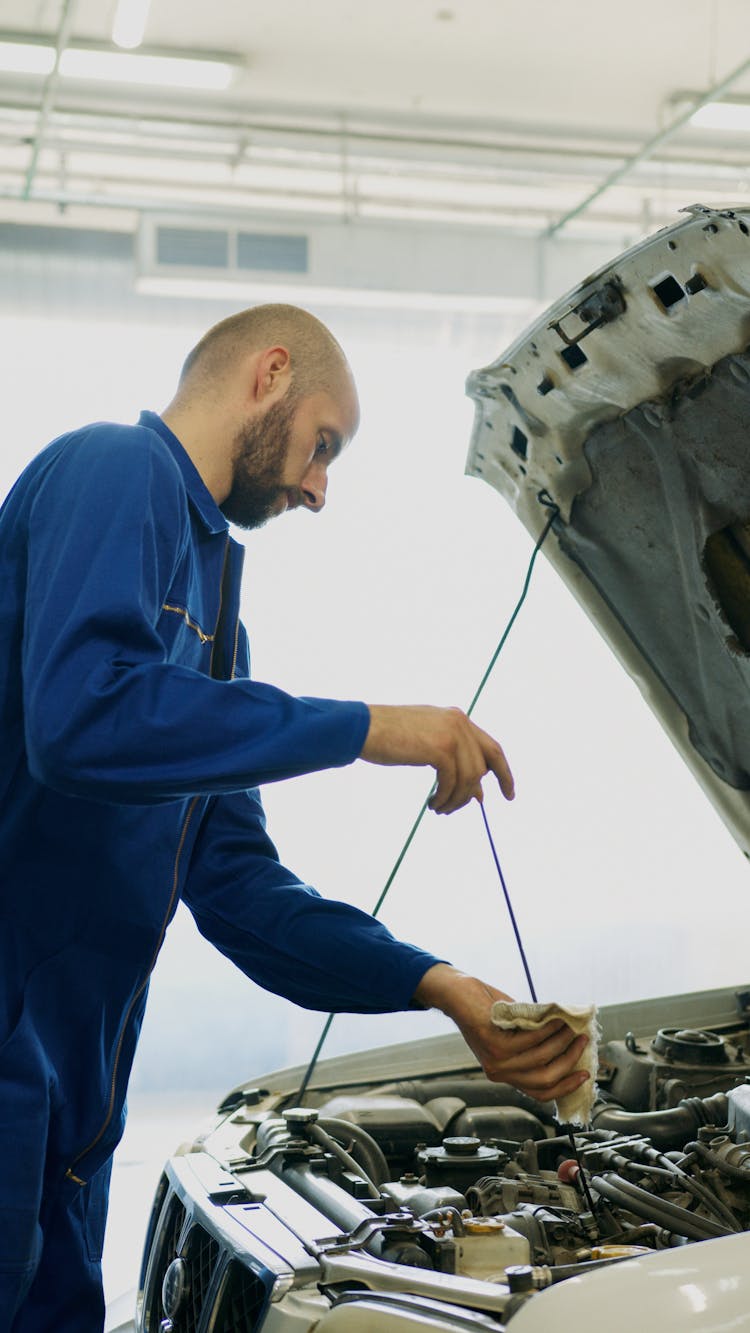 A Mechanic Fixing A Car