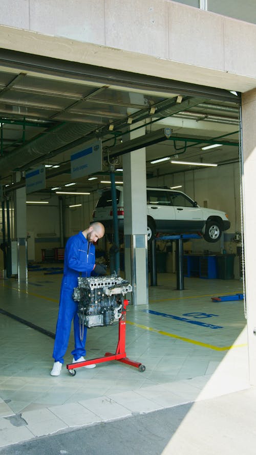 Mechanic Looking at an Engine