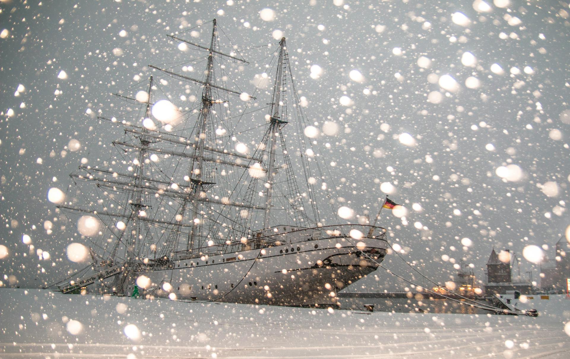 White Sailing Ship Docked at Pier