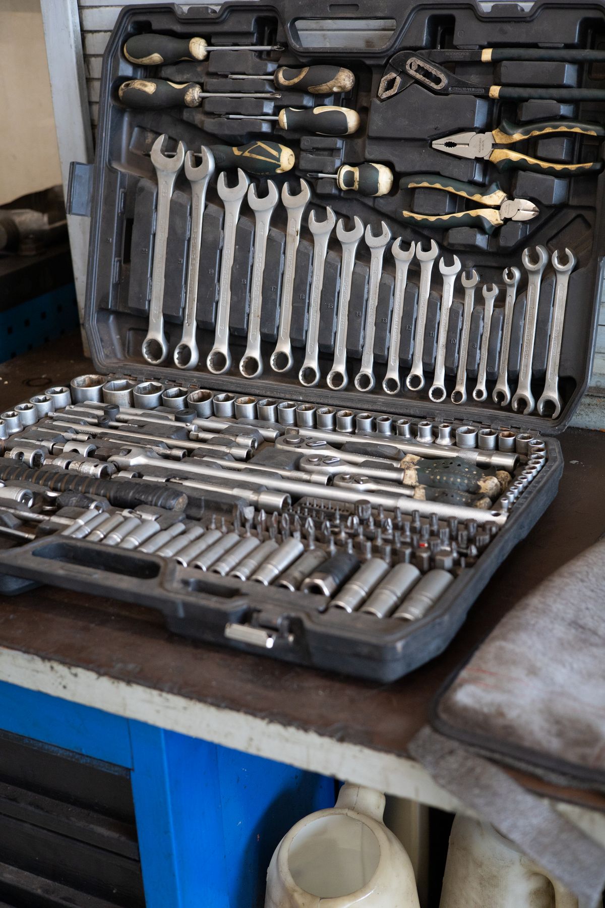 Automotive wrenches and tools organized inside a portable case