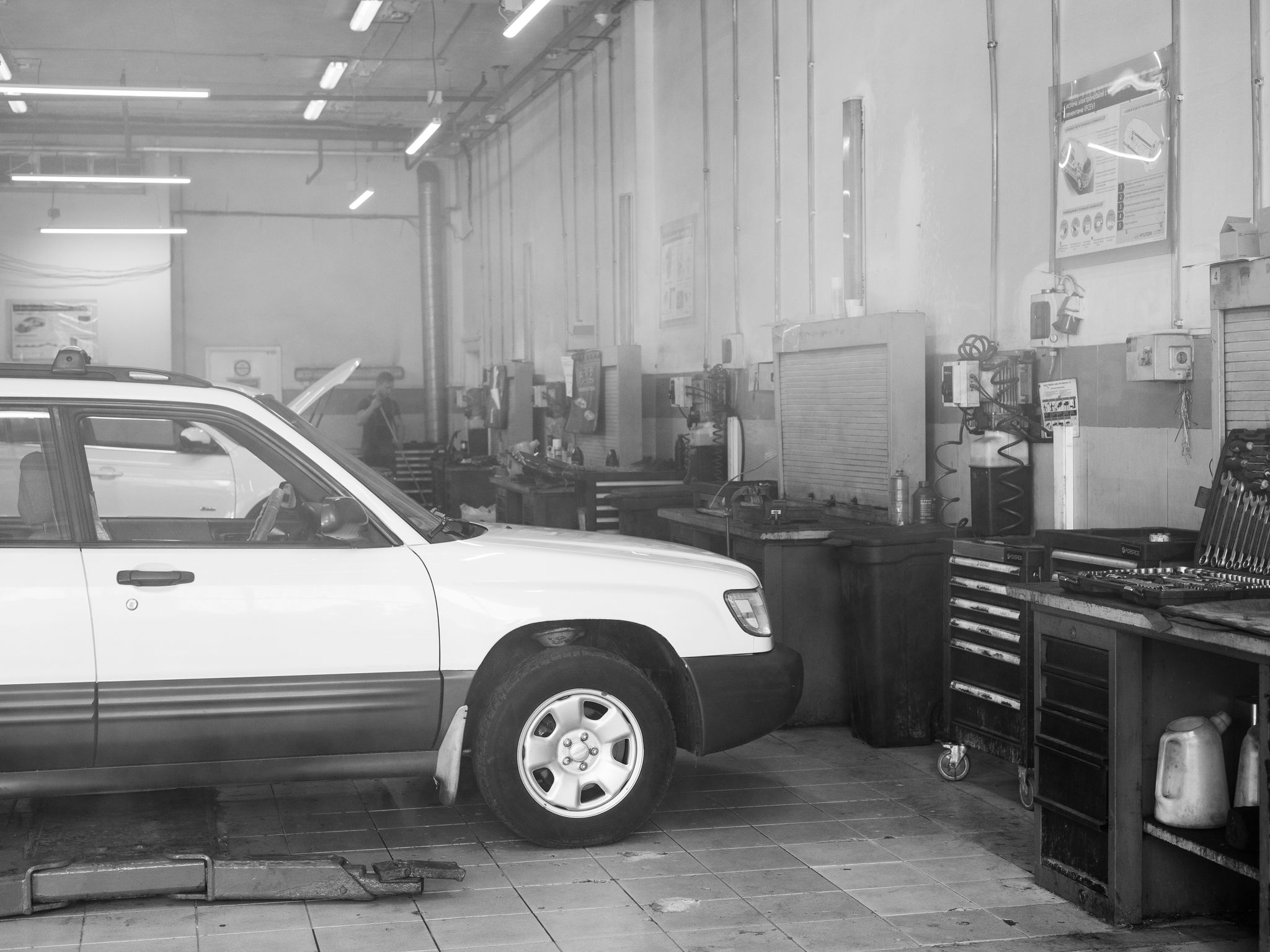 Mechanic working on a car in a garage