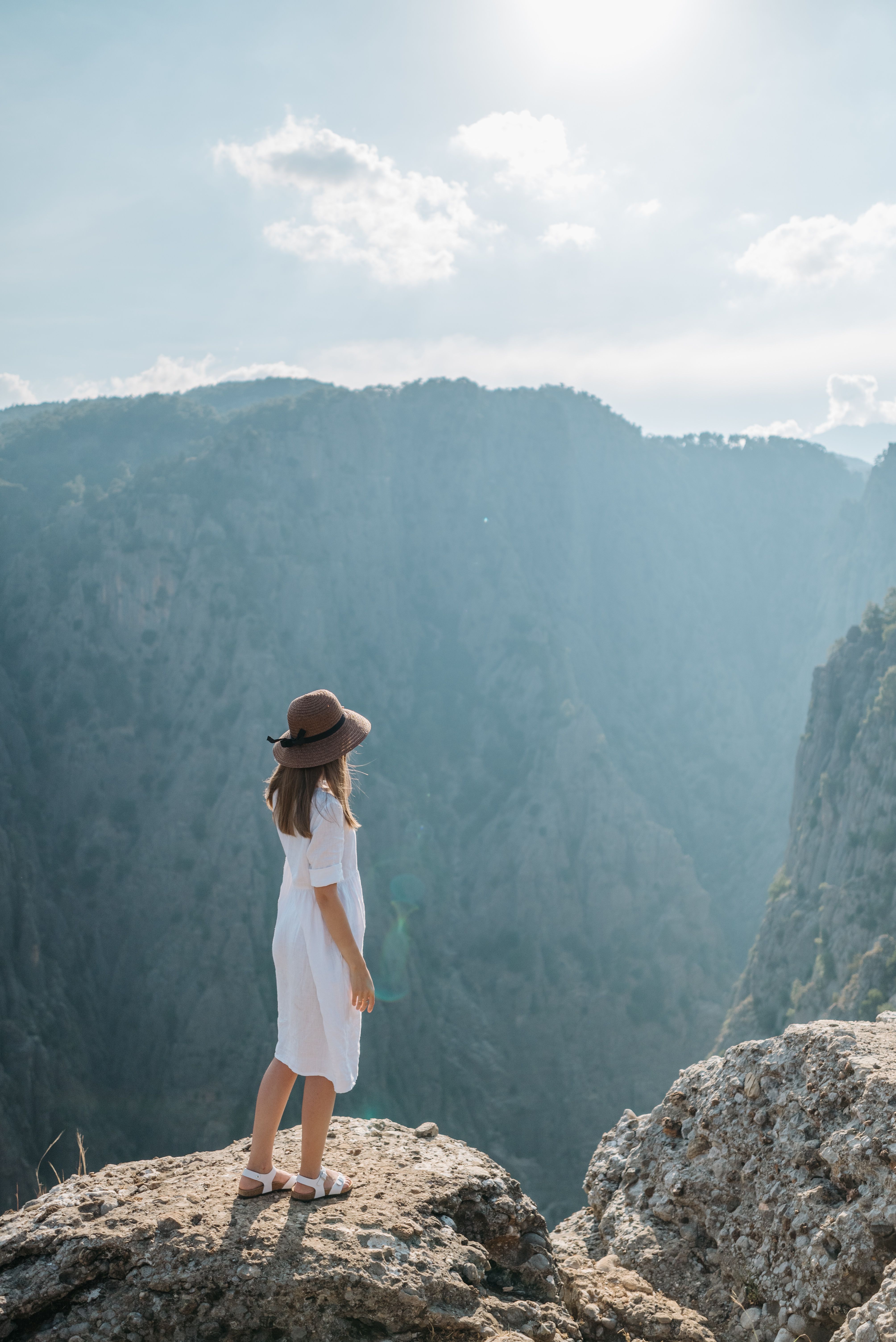 Woman in White Dress Standing on the Edge · Free Stock Photo