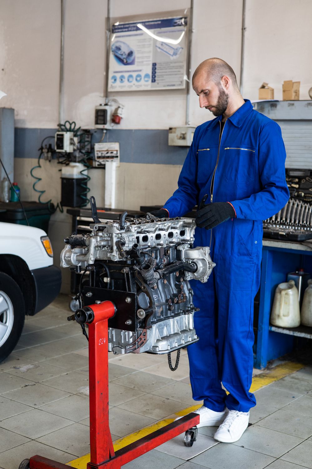 Professional mechanic inspecting a car engine