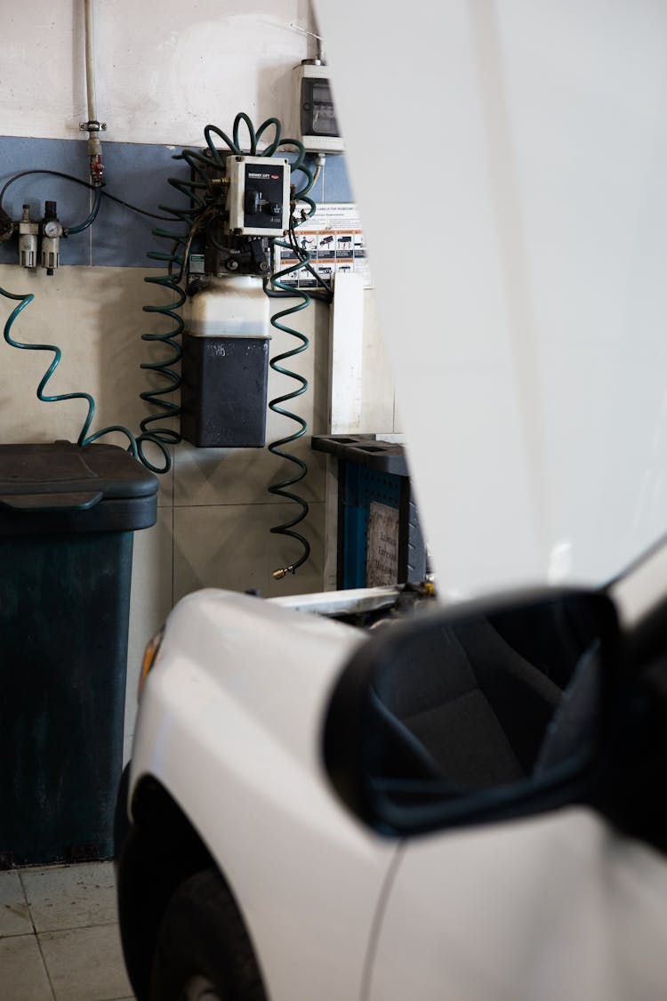 A White Car In An Auto Repair Shop