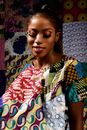 Woman in Colorful Patchwork Dress Smiling