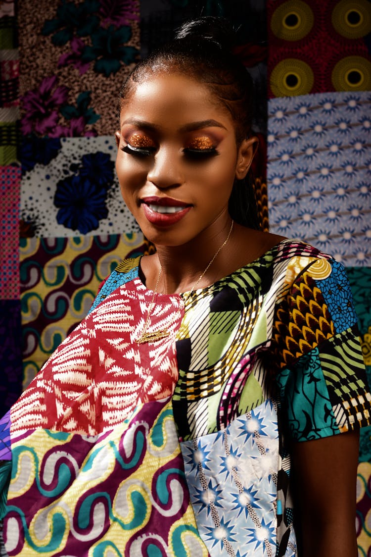 Woman In Colorful Patchwork Dress Smiling