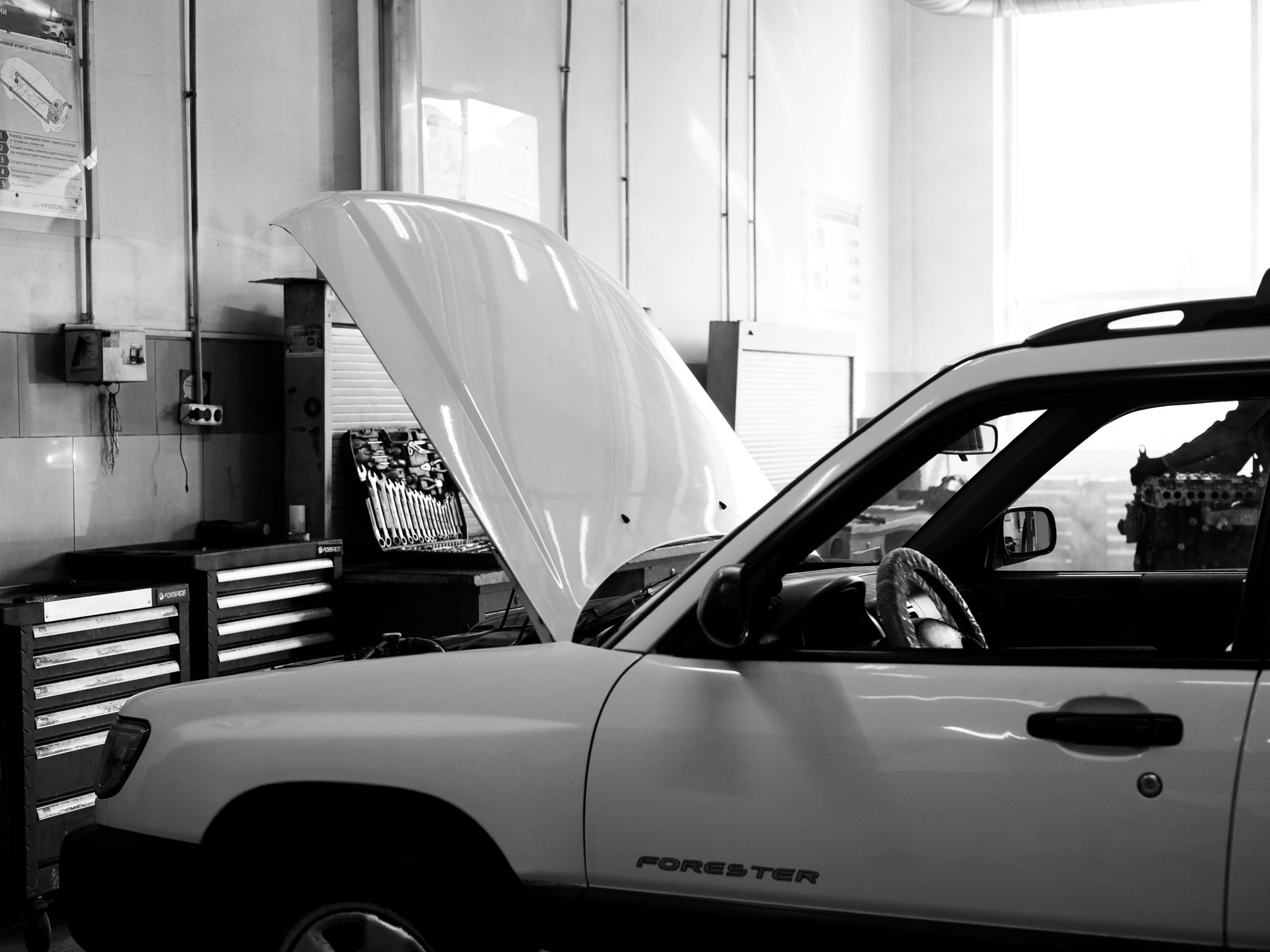 Mechanic working on a car in a garage