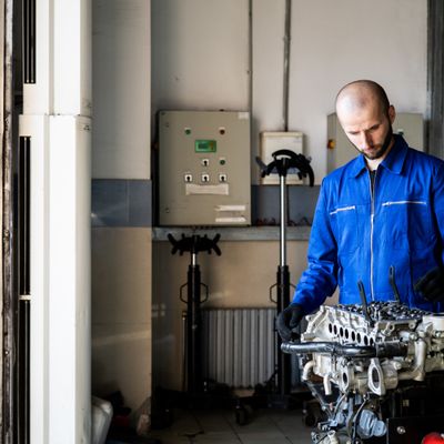 Mechanic working on vehicle
