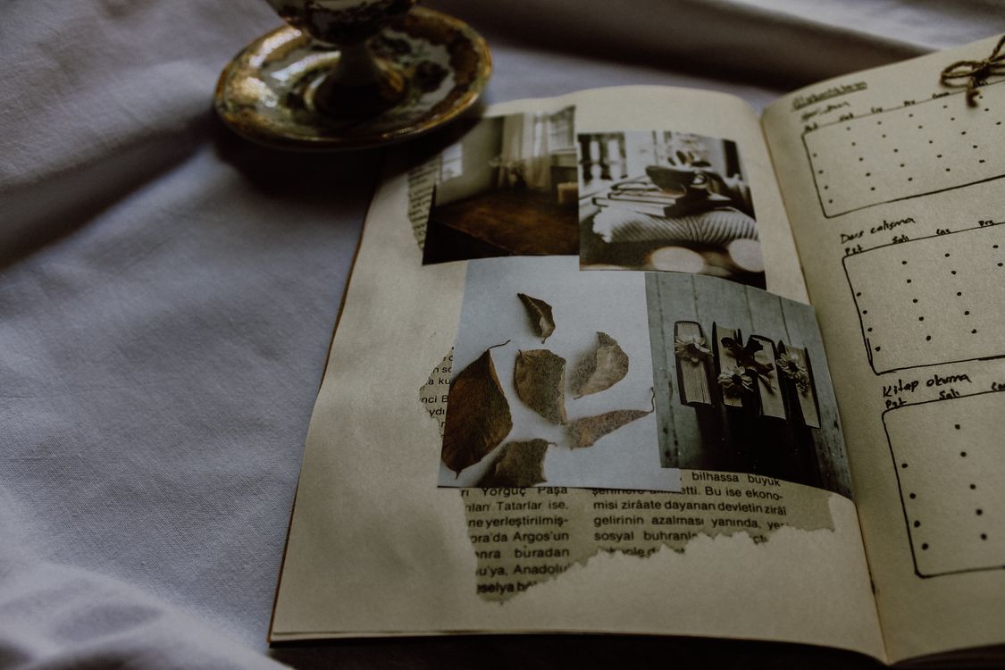 vintage scrapbook with artistic photographs and journal entries