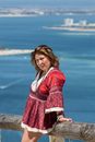 Woman in Red Long Sleeves near the Railings