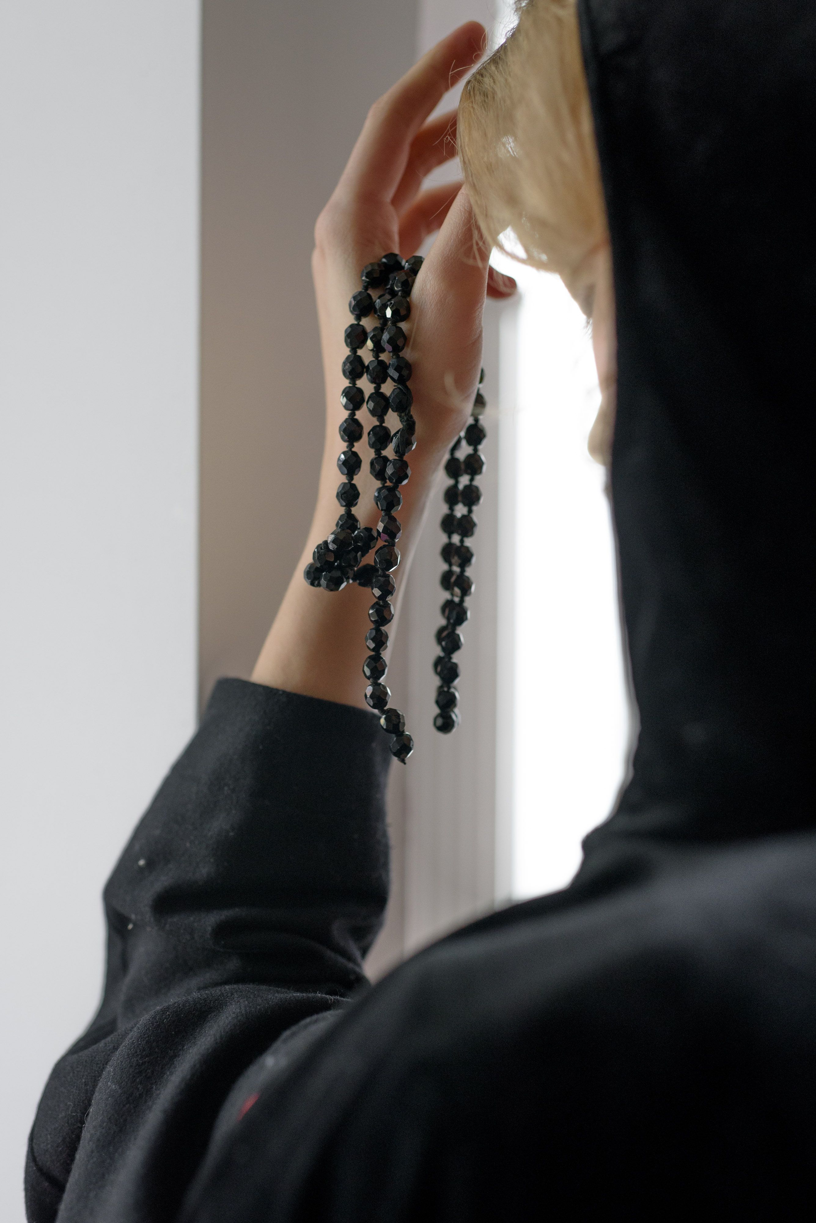 A Person Holding Prayer Beads · Free Stock Photo