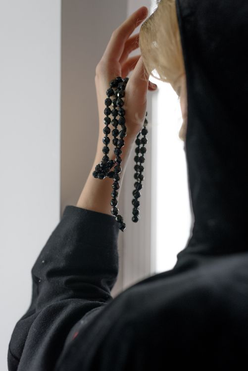 Close-Up Shot of a Person Holding Prayer Beads · Free Stock Photo