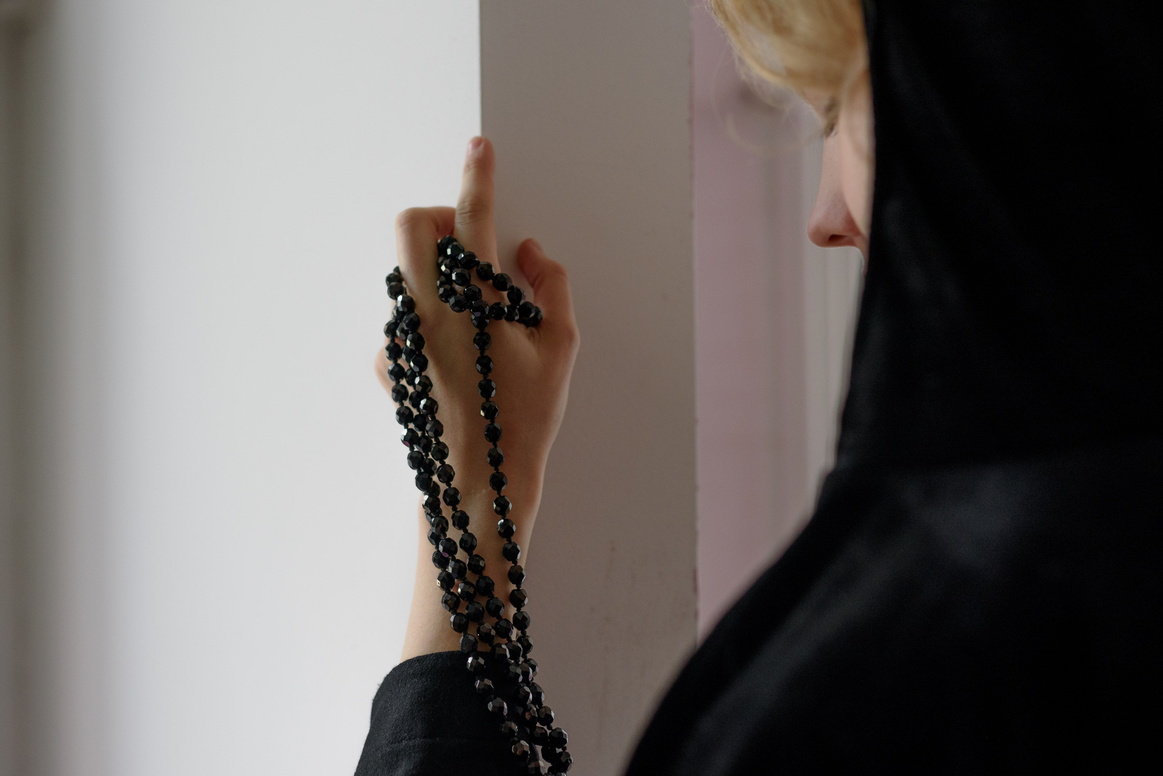 A Woman with a Prayer Beads on Hand · Free Stock Photo