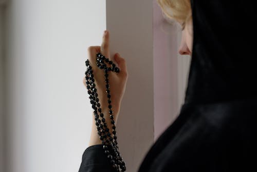 A Woman with a Prayer Beads on Hand