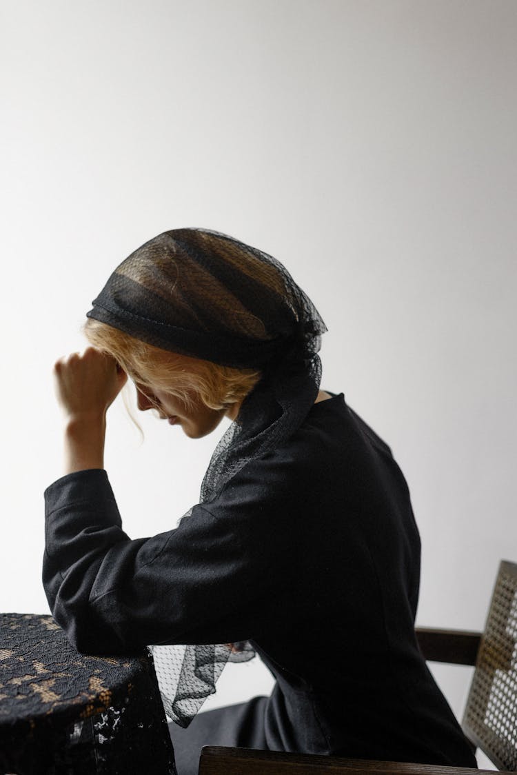 A Grieving Woman In Black Dress