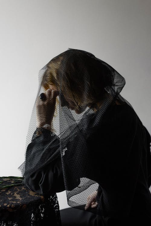 Free A Woman in Black Dress Grieving Stock Photo