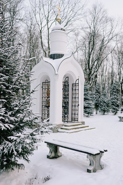 Small Orthodox Chapel in a Snowed Park