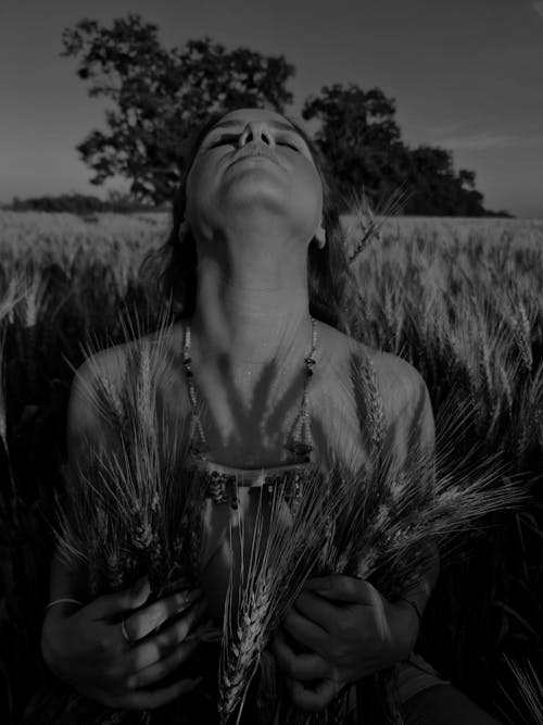 A Woman Posing in the Wheat Field