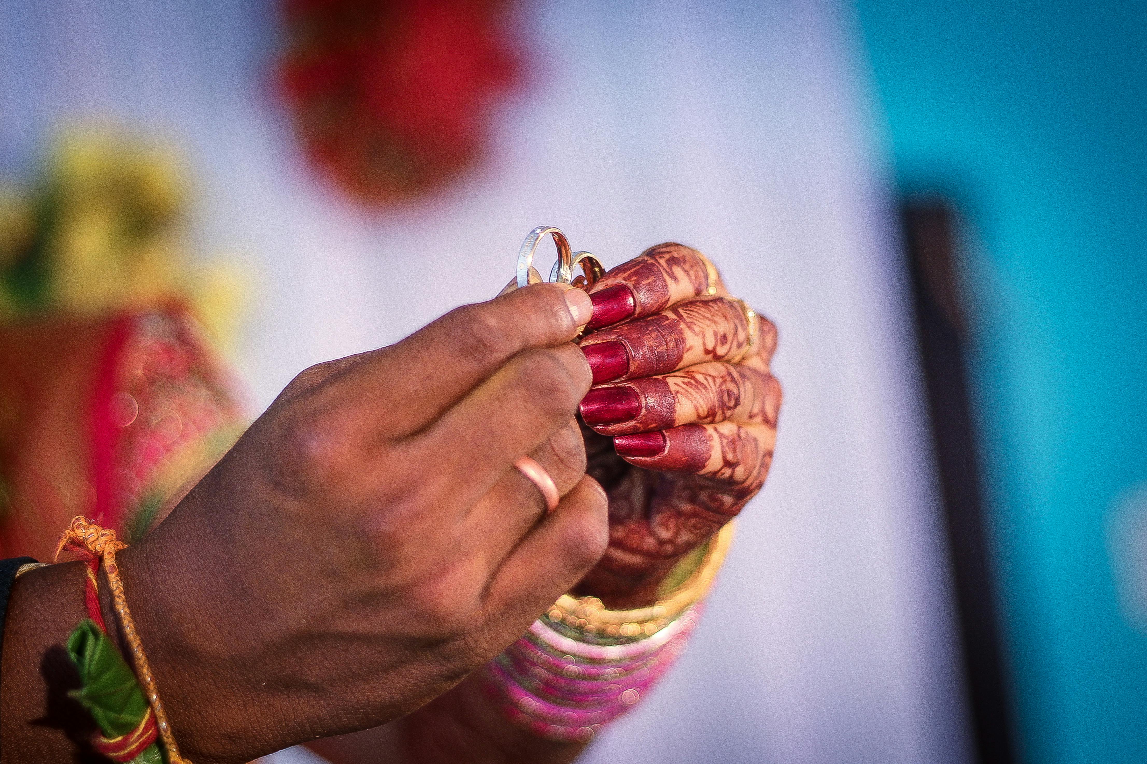 Man and Woman Holding Wedding Rings · Free Stock Photo