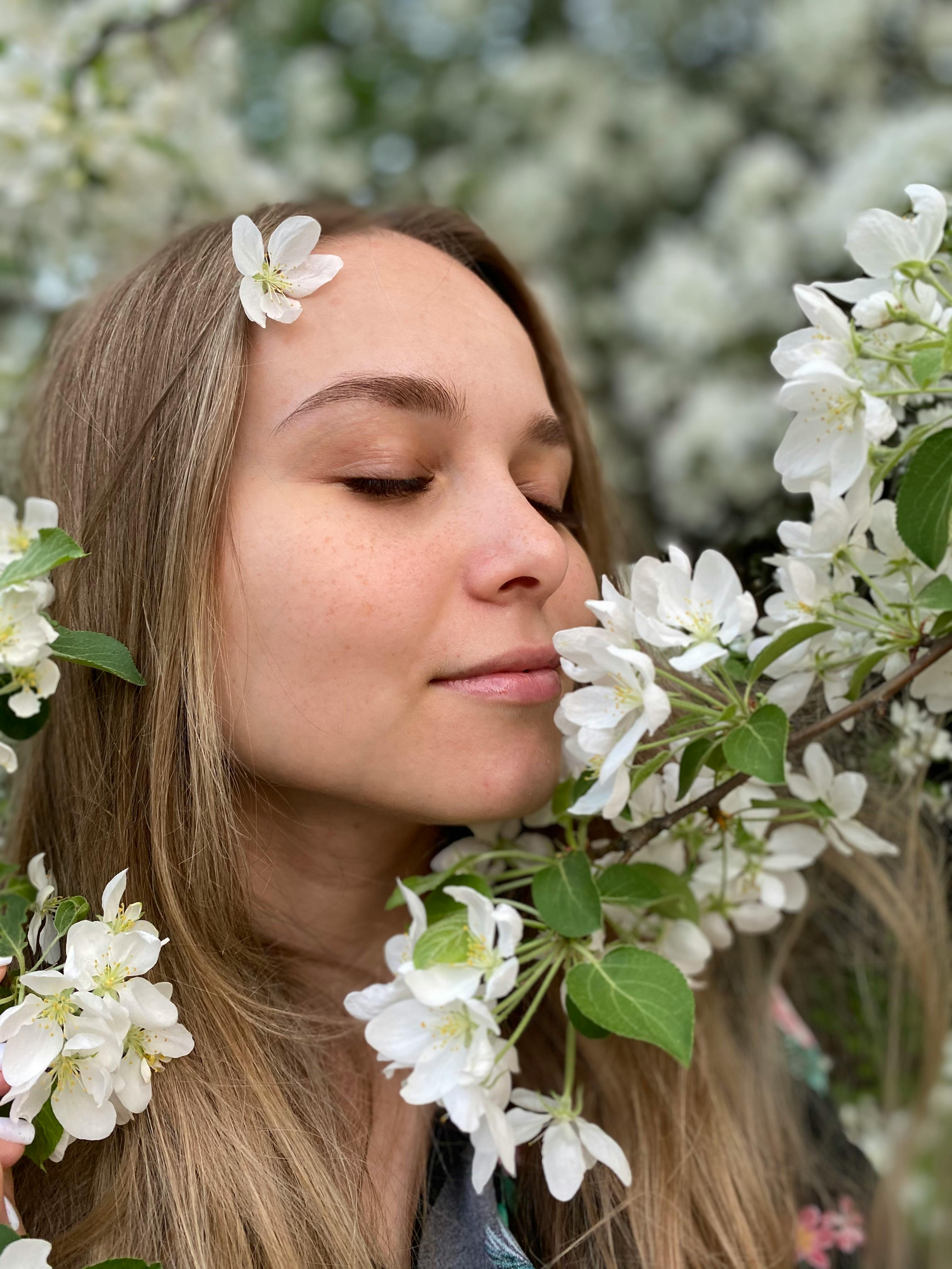 Woman With Blond Hair Near Clusters of White Flowers · Free Stock Photo