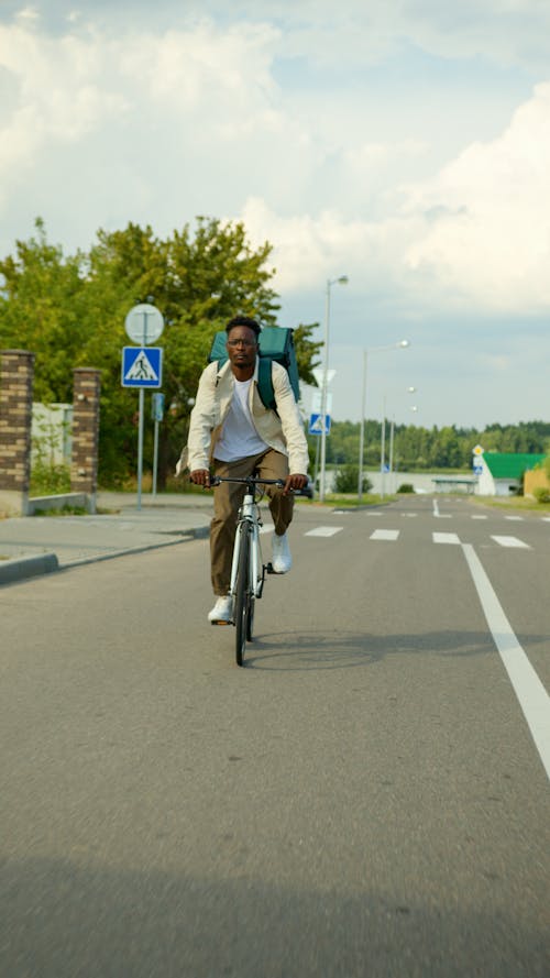 A Delivery Man Riding a Bike 