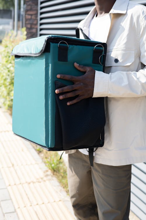 A Close-Up Shot of a Man Holding a Bag