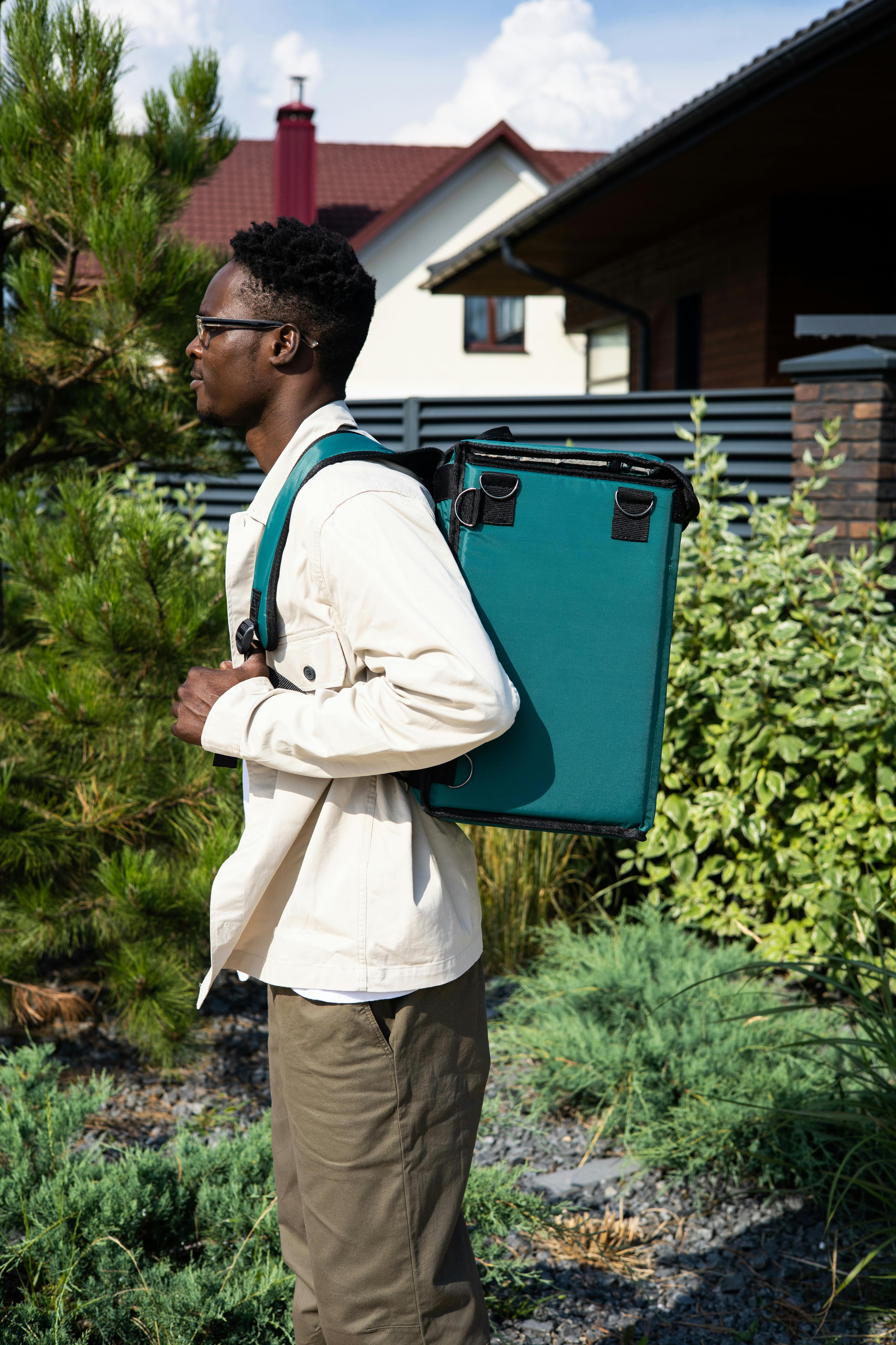 Luxon Travel Backpack in AO Black Ballistic displayed in urban setting