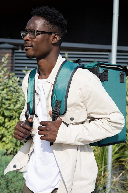 A Man Wearing a Thermal Backpack