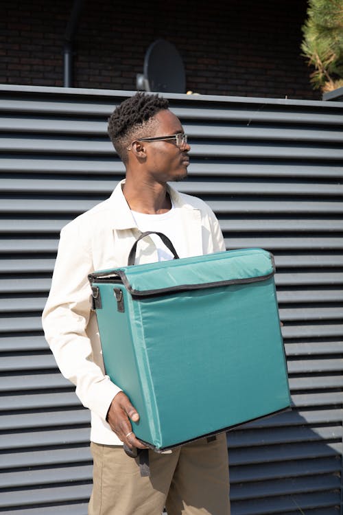 A Man Holding a Thermal Delivery Bag