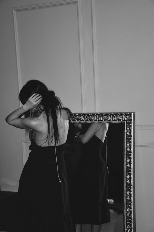 Free Back View of a Woman in Black Dress Stock Photo