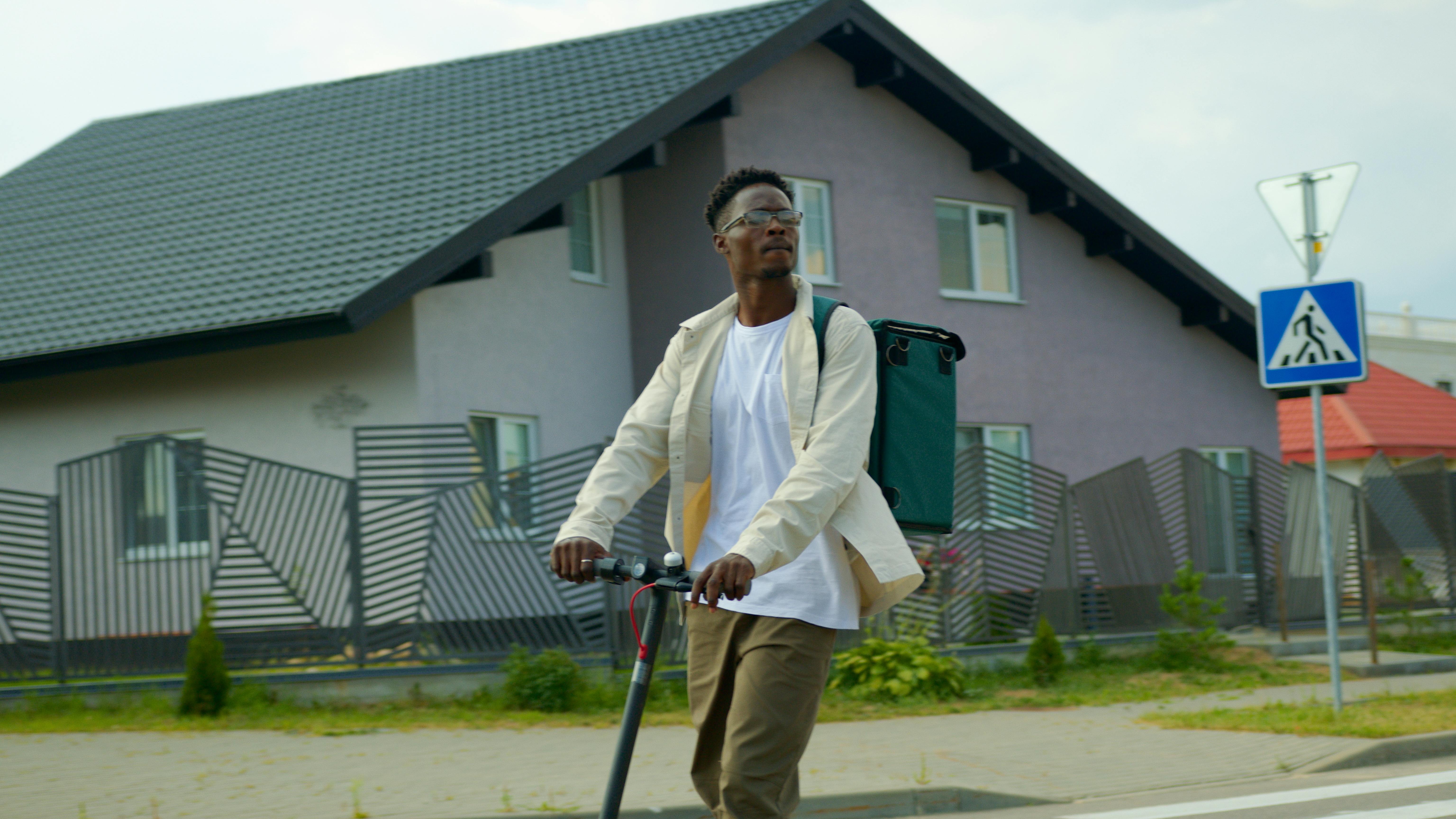 a man riding a scooter