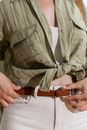 Person Tightening a Belt