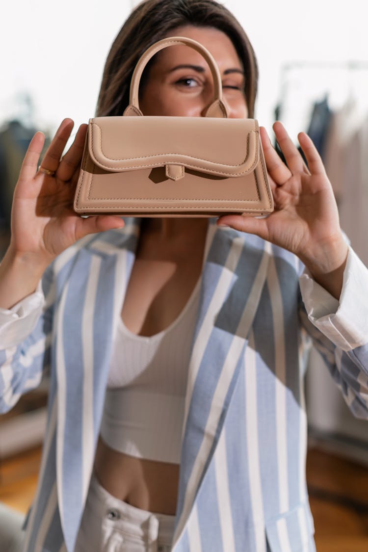 A Woman Holding A Handbag