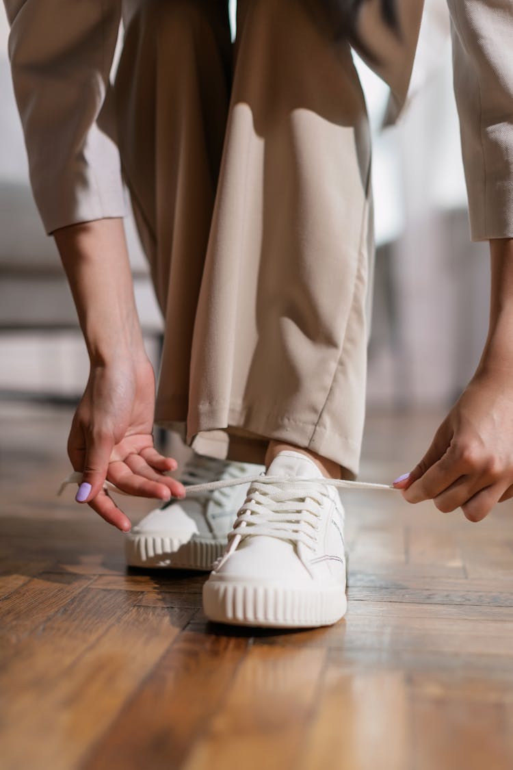 A Person Tying Their Shoelaces