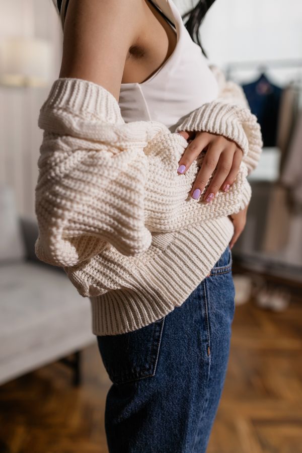Woman in dark skinny jeans with cashmere sweater
