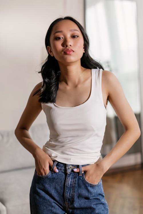 Free Close-Up Shot of a Woman in White Tank Top Stock Photo