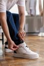A Person Holding the Sneaker