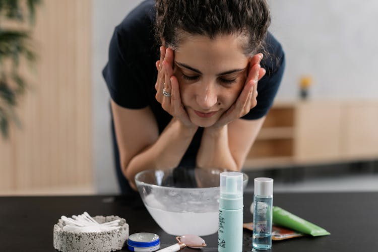 A Woman Washing Her Face