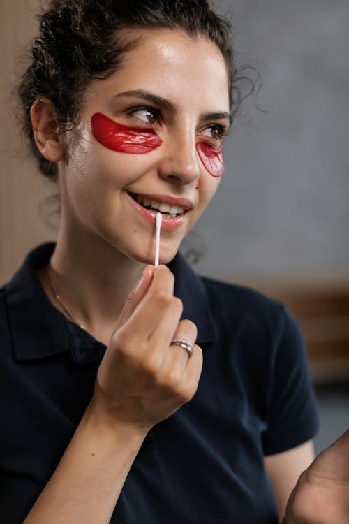 Free A Portrait of a Woman with Under Eye Masks Stock Photo