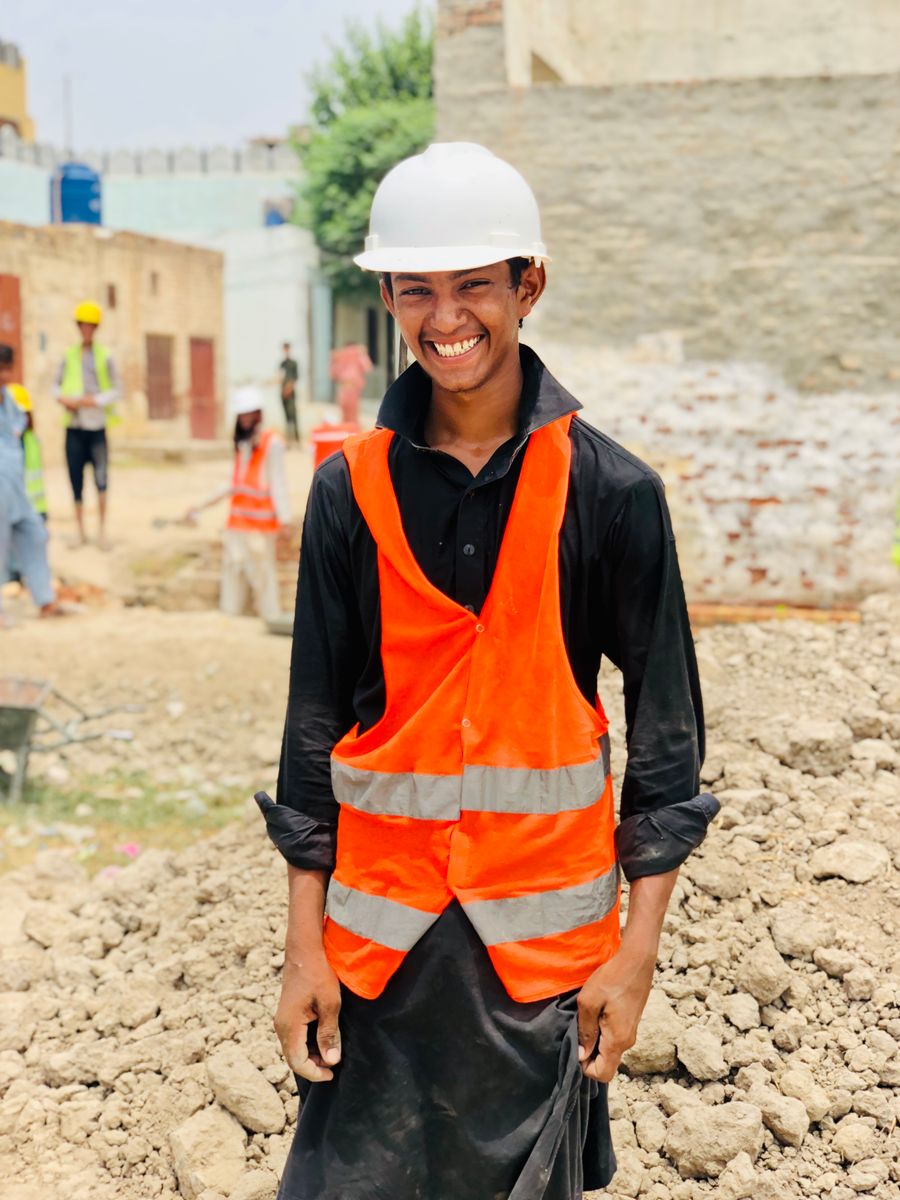 Construction technician in safety gear on site in Punjab