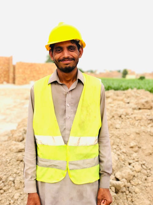 Portrait of a Man in a Hard Hat and Safety Vest