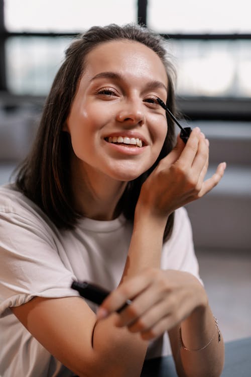 Woman in White Crew Neck T-shirt Smiling