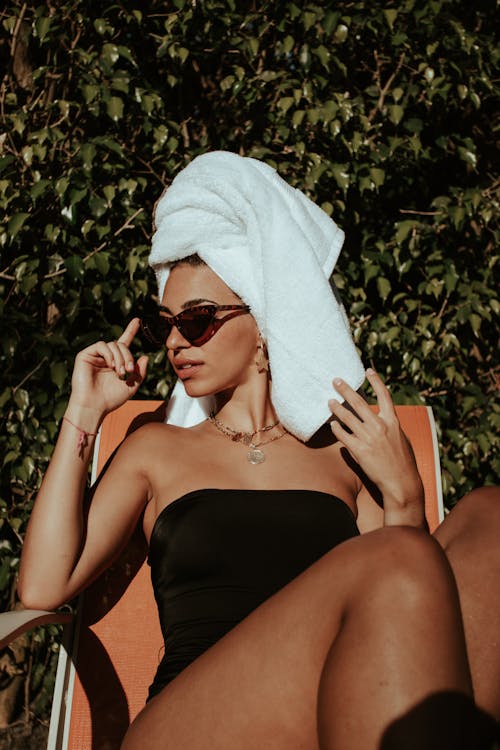 Free Woman in Black Tube Swimsuit with a Towel on Her Head Stock Photo