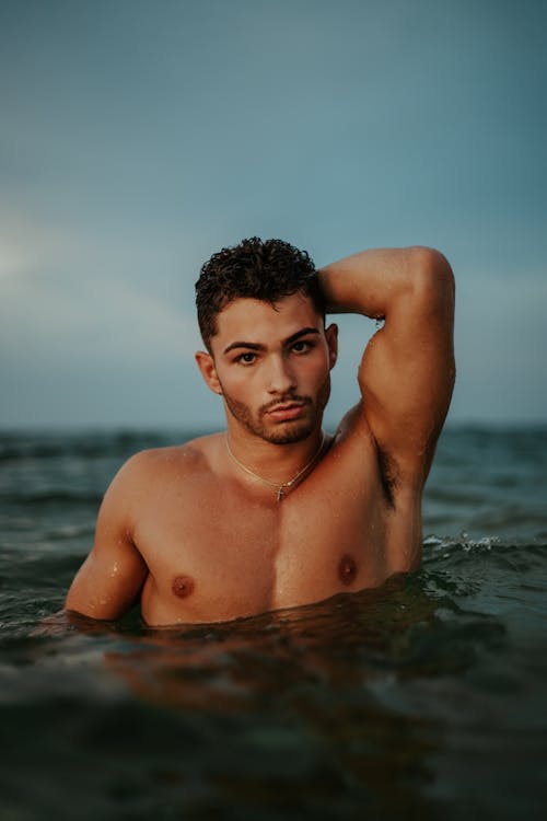 A Topless Man in Water