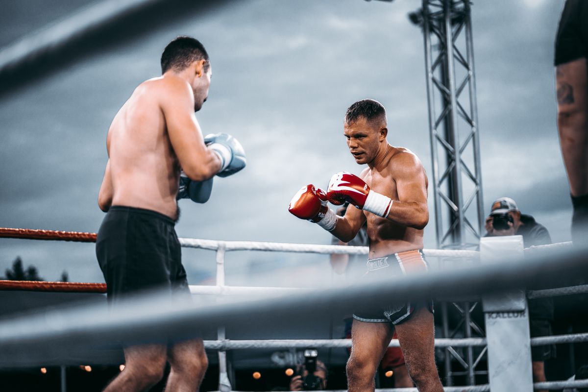 Two fighters squaring off in a boxing ring