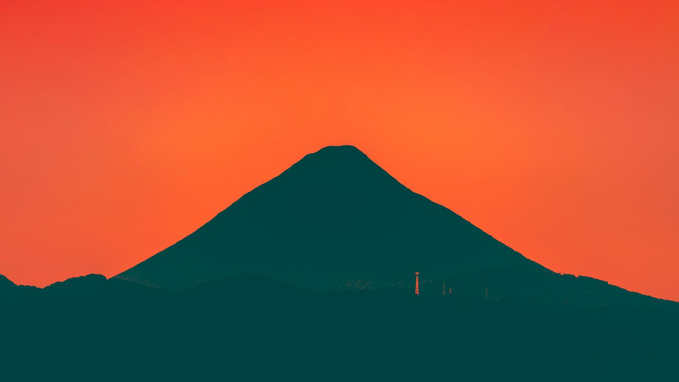 Sunset silhouette over water representing the track Light of Hope