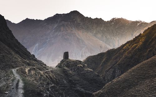 Free Explore the ancient ruins in Georgia's breathtaking mountain landscape at dawn, offering a glimpse into history. Stock Photo