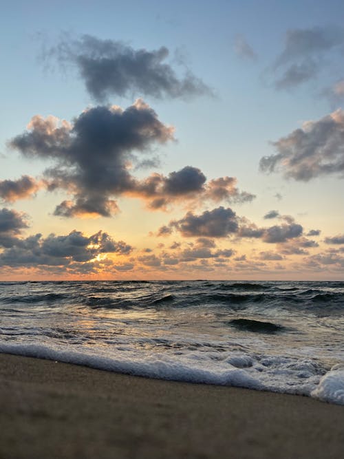 Ocean Waves Crashing on Shore during Sunset