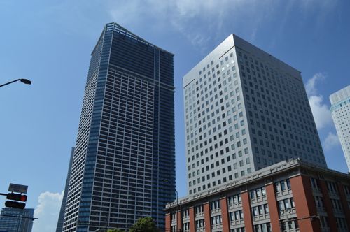 Free Urban skyscrapers in Yokohama City showcasing modern architecture under blue skies. Stock Photo