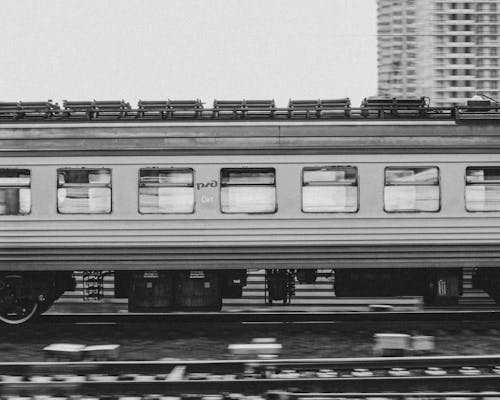 Free A Train in Motion Passing Through a Rail Track Stock Photo
